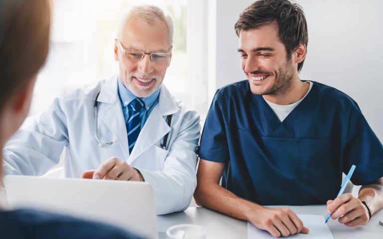 senior-doctor-professional-showing-information-on-2022-06-21-17-55-07-utc.jpg